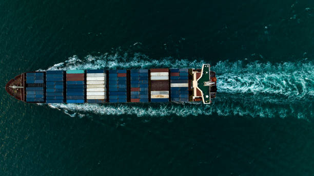 istock cargo container ship carrying in sea to import export goods and distributing products to dealer and consumers across asia pacific worldwide, global business and industry delivery service  by container ship Transport. 1513024810