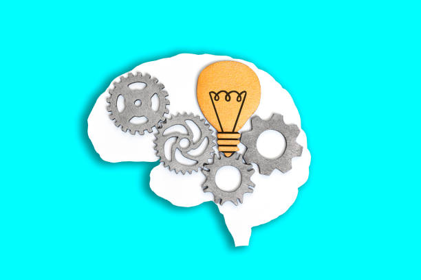 istock Human Brain with Gears and Lightbulb on Blue 1513037306