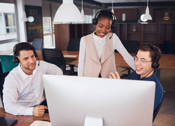 istock Call center employees, training and diversity, team and support, customer service with headset and computer. CRM, phone call and happy with black woman leader, coaching and contact us in office 1513058153