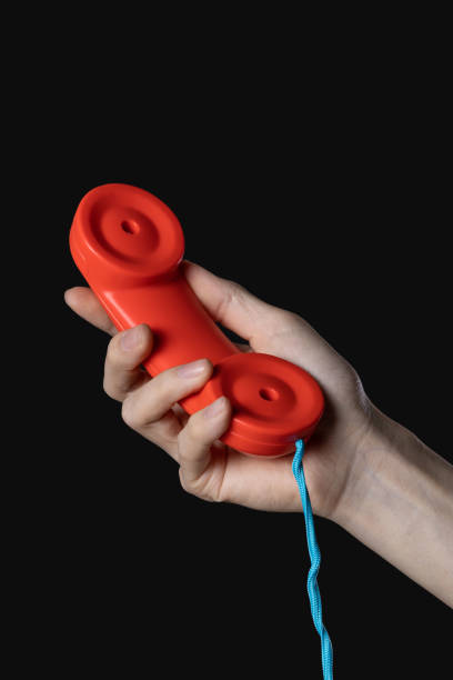 istock Hand holding red telephone 1513064816
