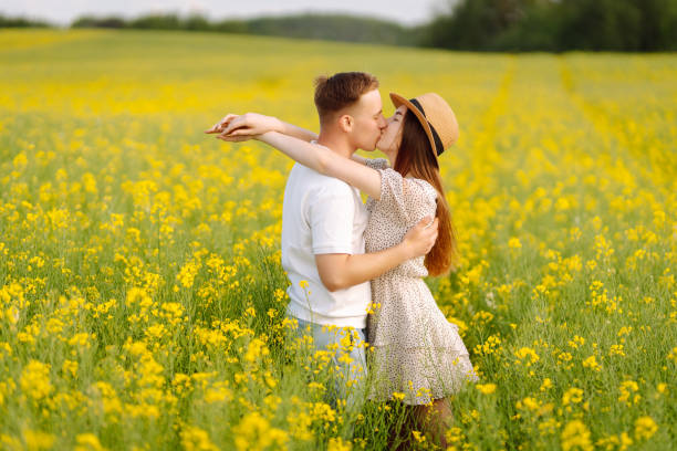 istock Young Couple in the blooming field. 1513071812