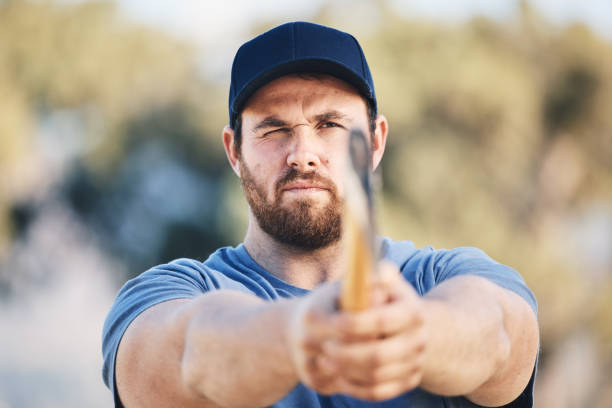 istock Target, focus and axe throwing with man in nature and aim for sports, training and tomahawk skills.  Exercise, goal and hunting with athlete and hatchet in range for bullseye, ready and competition 1513104786