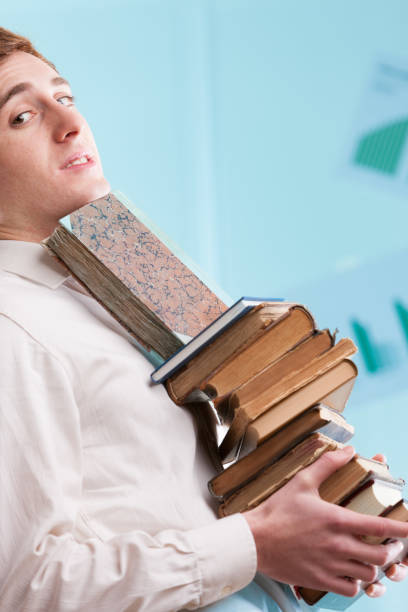 istock Man holds old books, symbolises time-layered wisdom 1513131973