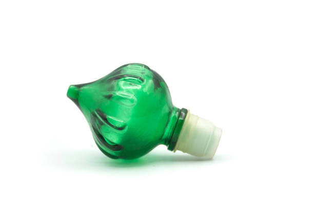 Closeup of green glass plug of bottle on white background