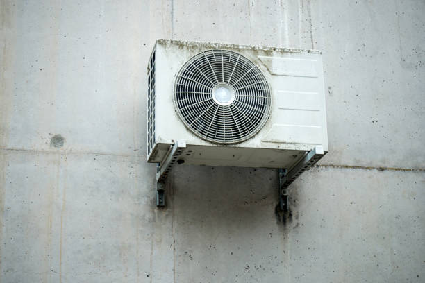 istock Cooling Fan Air Conditioner on stoned wall background 1513147871