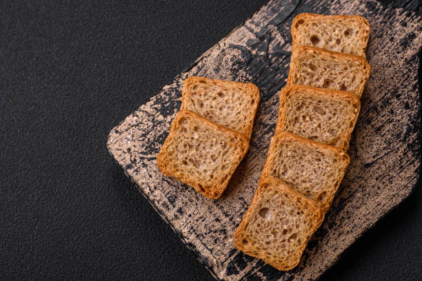 istock Delicious salted rectangular wheat croutons with salt and spices 1513179025
