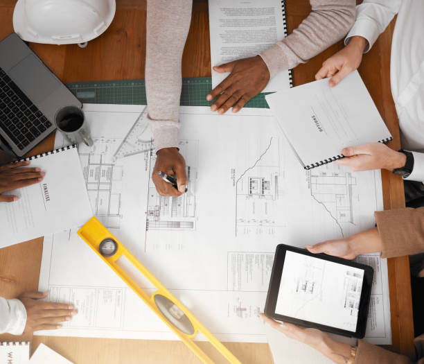 istock Tablet, floor plan and architecture people planning, project management and teamwork for design illustration. Engineering group or team hands collaboration on digital screen of blueprint construction 1513191932