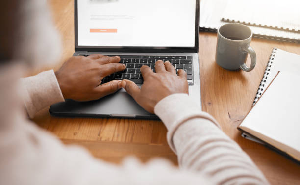 istock Business man, hands and laptop typing of a corporate worker with workplace notes for project. Writing, email and person with notebook and research analysis for online reading and career report 1513191940