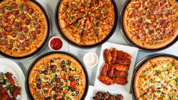 Table top view of pizza ready to be served.