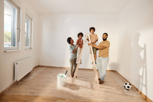 istock Happy black family on ladder during home renovation process. 1513209832