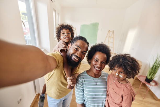 istock Happy black family taking a selfie during home renovation process. 1513212687