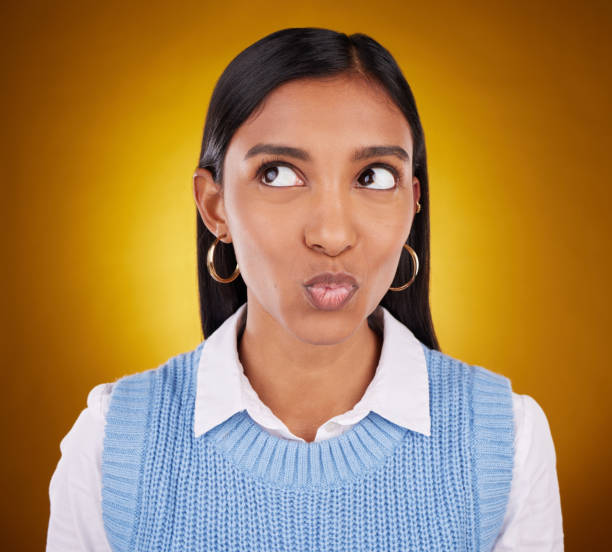 istock Thinking, idea and woman in studio unsure, pensive and wondering on gradient yellow background. Contemplating, doubt and puzzled Indian lady with decision, choice or emoji while posing isolated 1513238416
