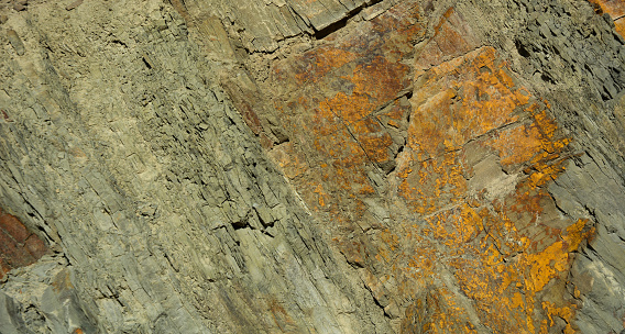 Slate texture on slate-phyllite metamorphic rock. Nature background.