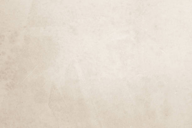 istock Colour old concrete wall texture background. Close Up retro plain cream color cement wall background texture. Design paper vintage parchment element show or advertise or promote product on display. 1513249728