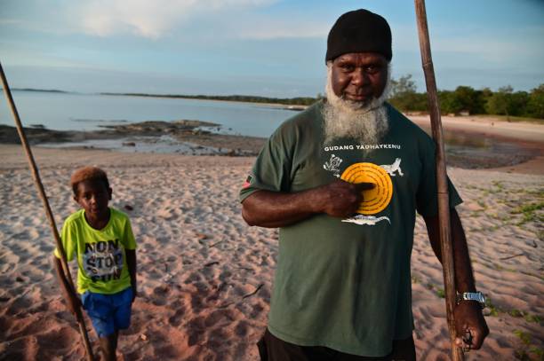 Torres Strait Islanders grandfather and grandchild Cape York Queensland Australia stock photo