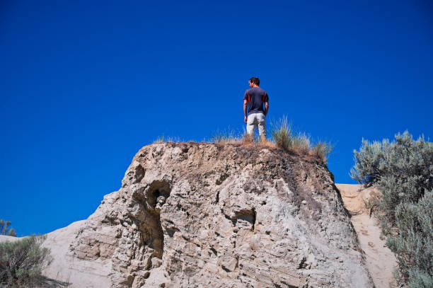 istock Mature man standing on the rock 1513262771