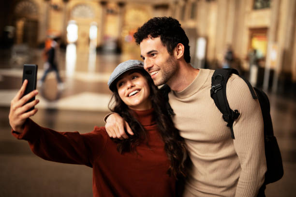 istock Young woman and man waiting to board a train. 1513280814