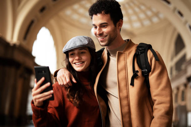 istock Young woman and man waiting to board a train. 1513281353