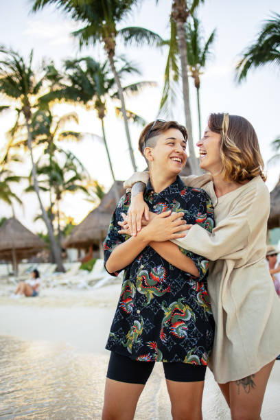 istock Same sex couple enjoying at the beach 1513284067