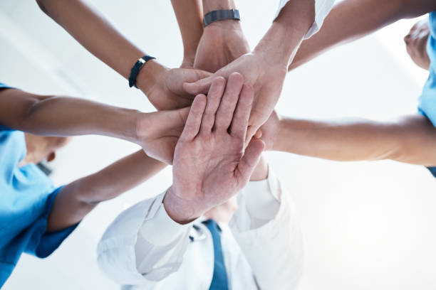 istock Below, group and hands stack for medical, staff and teamwork in hospital for motivation. Team, doctor and nurse with hand for collaboration, healthcare and help in community at job together in clinic 1513285123