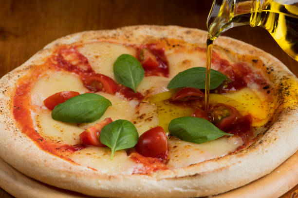 Drizzling Olive Oil on Pizza
