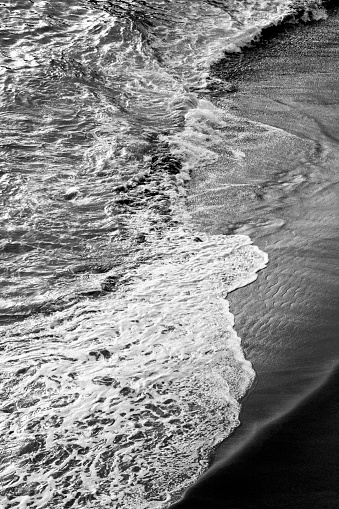 Beach seen from viewpoint, breaking waves. Sao Miguel island, Azores, Portugal.