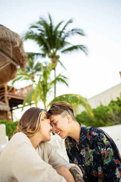 istock Same sex couple enjoying at the beach 1513304432