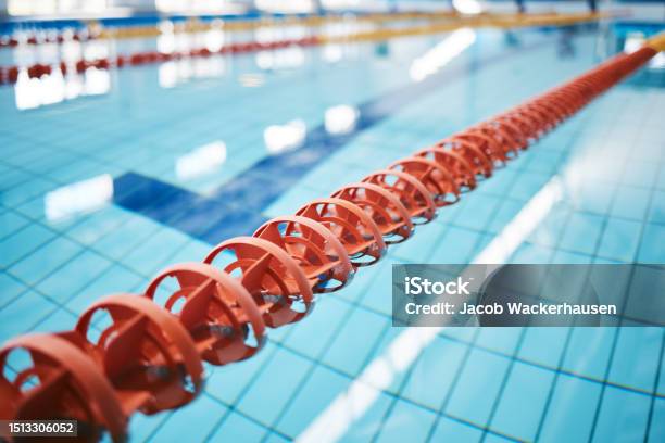 Water Empty Swimming Pool And Lanes For Competition Exercise And Workout Sports Swim And Fitness With Lane Ropes Or Divider In Liquid For Aquatic Training Exercising Or Underwater Practice Stock Photo - Download Image Now