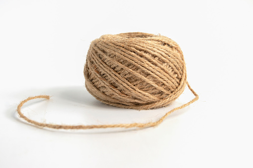 Skein of linen string cord isolated. Coil of twine. Jute rope. Hemp thread ball of cord isolated on white