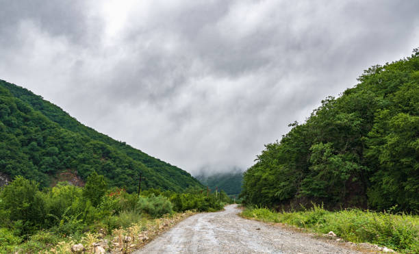 istock Wet dirt road in mountainous area 1513340697
