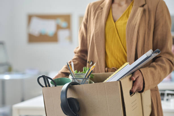 istock Woman packing things in box during the move 1513363392