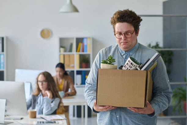istock Upset businessman leaving his workplace 1513366728