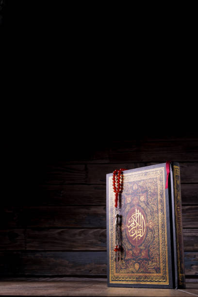 istock The Holy Al Quran with written Arabic calligraphy 1513387489