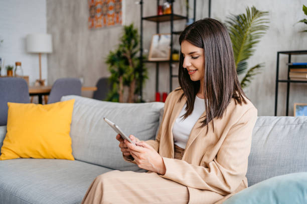 istock Young Woman Using Her Digital Tablet At Home 1513405222