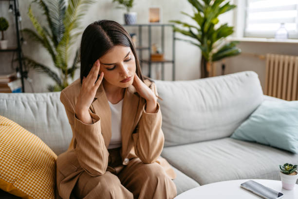 istock Stressed Young Woman Having A Headache 1513407898