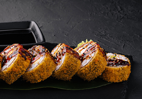 Maki Sushi set on dark pattern background