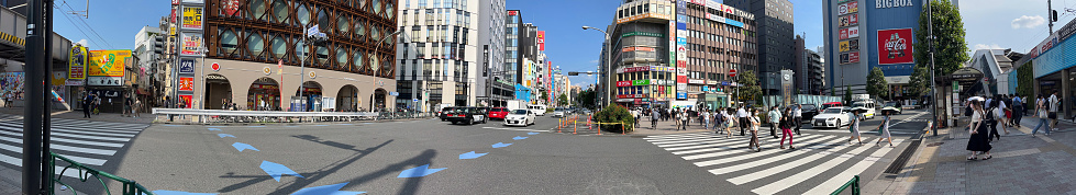 A photo of the scenery around Takadanobaba station, which was divided and edited into a panoramic photo with software, photo data July 04, 2023 Tokyo, Shinjuku-ku, around JR Takadanobaba station, Japan.