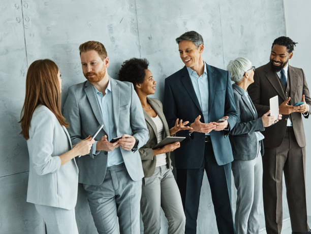 istock young business people meeting office teamwork group network wireless internet tablet smartphone mobile phone connection technology laptop computer together 1513429699