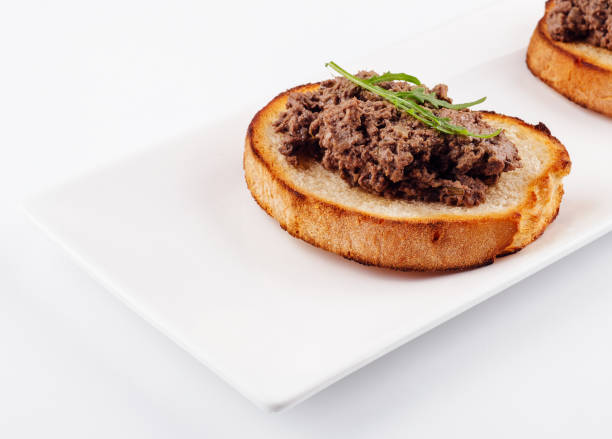 istock delicious italian bruschetta with truffle pate on white plate 1513440308