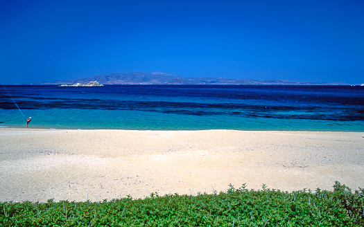analog photo of the sandy beach of Mikri Vigla and the Aegean seaand the sea