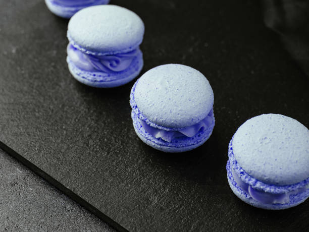 Delicate crumbly delightful pink macaroons close up