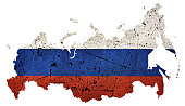 National flag of Russia overlaid on map of the country, with a distressed concrete texture, isolated on white