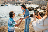 Young Woman Filming Her Male Friend Proposing To His Girlfriend In Dubrovnik Bay