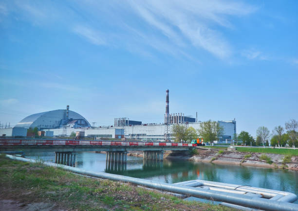 istock nuclear reactors of Chernobyl power plant next to Pripyat river, 4th exploded reactor with sarcophagus on left, 3th reactor on right, Exclusion zone, Ukraine 1513492142