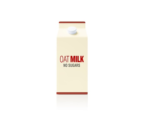 Cream colored oat milk package on white background. Horizontal composition.