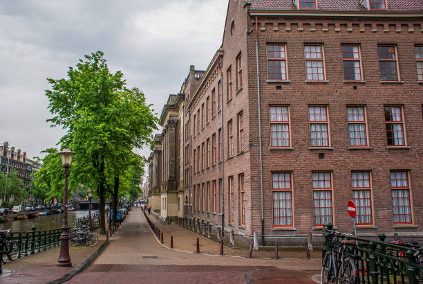 istock a large brick building next to a road 1513502939