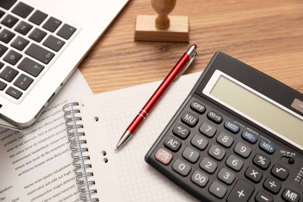 istock Business report preparing with calculator on desk 1513521391
