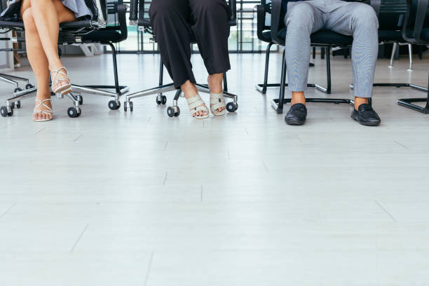 istock Below Knee Shot Of People Sitting 1513529144