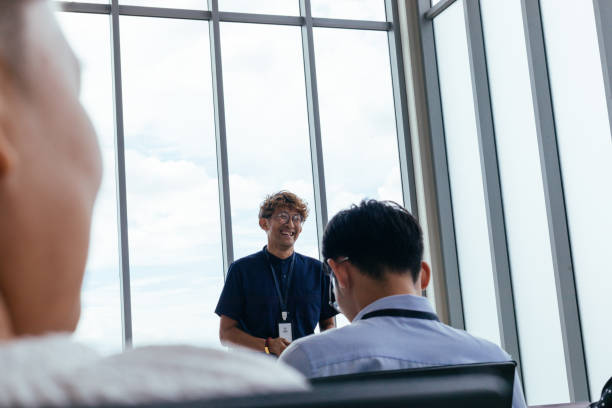 istock Team Leader Laughing During Speech 1513529660