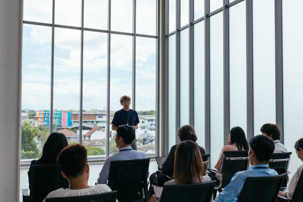 istock Bright and professional Asian male motivational speaker during presentation 1513530708